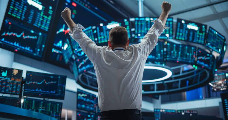 Trader celebrating on a trading floor